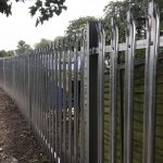 Steel commercial fencing, securing a private space.