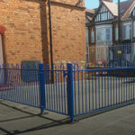 Bespoke blue railings surrounding a schoolyard in Birmingham.
