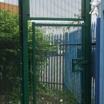 Green double wire mesh gates. These commercial gates are used to keep vehicles secured.