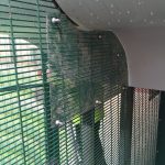 Green double mesh commercial fencing.